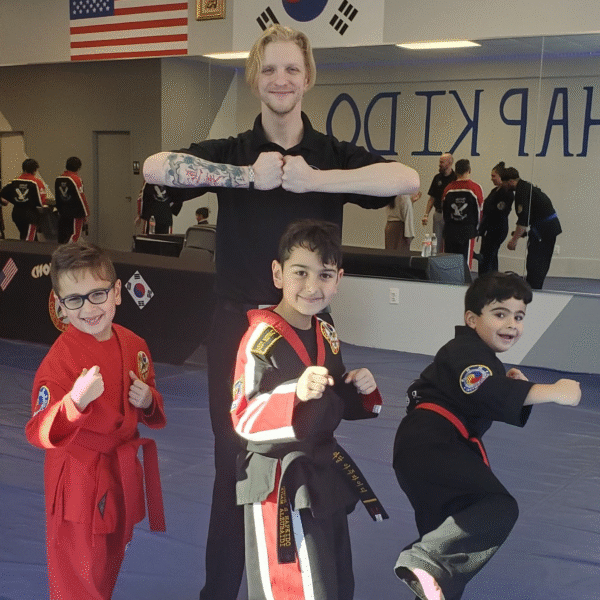Instructor demonstrating martial arts techniques with students at Choe’s HapKiDo Flowery, GA